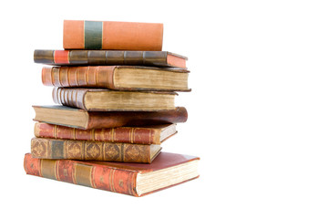 A pile of old leather bound books isolated on a white background