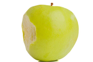 Green delicious apple with bite on a white background