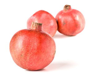 Fresh appetizing pomegranate on a white background
