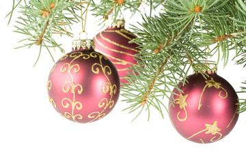 Fir tree branch with decoration on a white background.