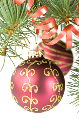 Fir tree branch with decoration on a white background.