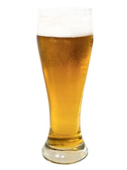 glass whith golden beer on the white surface