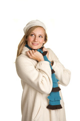 Pretty Blond wearing a winter white coat and hat