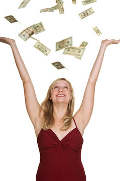 Beautiful blond with money falling around her