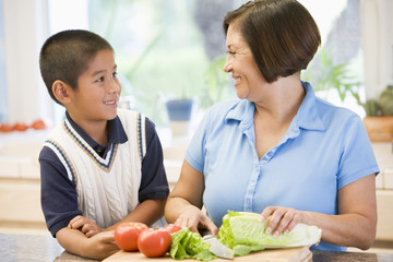 Grandmother And Grandson Preparing meal,mealtime Together