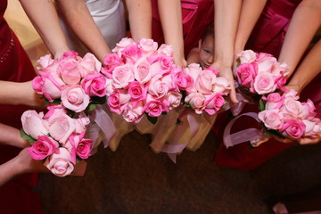 bridal party holding pink wedding flower bouquets