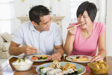 Obraz na płótnie Canvas Young Couple Enjoying Chinese Food