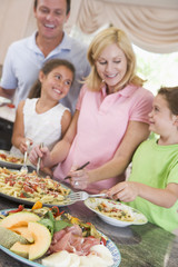 Mother Serving Up Dinner For Family