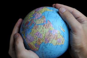 Close-up of Earth globe holded in hands