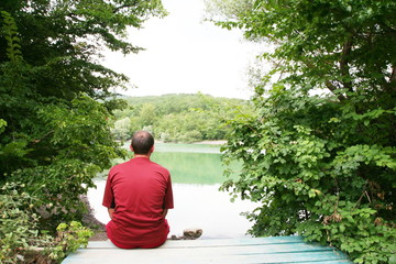 Fototapeta premium Men relaxing on lake