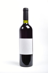 A single bottle of red wine on white background