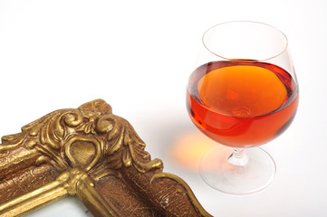 Cognanc in brandy snifer and a picture frame
