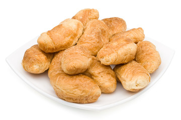 Fresh rolls on a plate on a white background