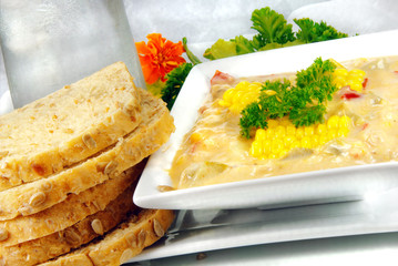 Home-made chicken corn chowder with bread.