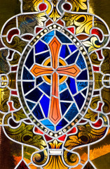 A stained glass rendition of a cross. - 9813954