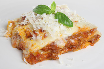 Freshly baked lasagna with grated parmesan