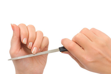 Woman hands and manicure nail file isolated on white background