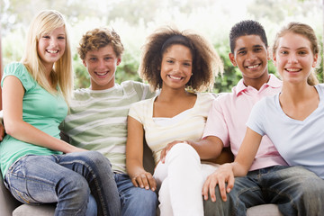 Group Of Teenagers Sitting On A Couch