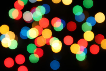 Colorful dots background made of bokeh fairy lights