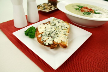 Creamy spinach soup with crispy bacon and cheese toast.