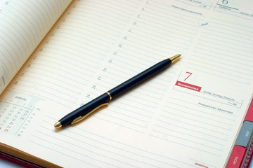 Business stuff - pen and agenda. Business concept...
