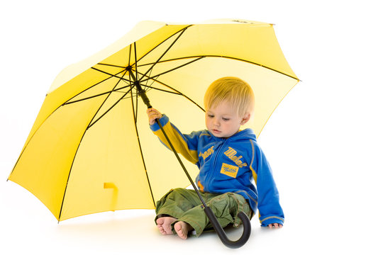 Little Boy With Yellow Umbrella