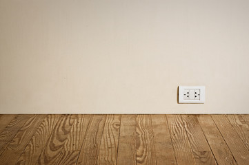 electric outlet in a wall in an old house interior