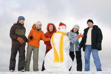 People having fun at sunny day at winter