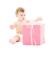picture of baby boy in diaper with big gift box