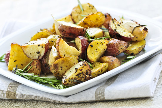 Herb roasted potatoes served on a plate