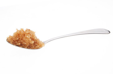 Spoonful of Demerera sugar isolated on white