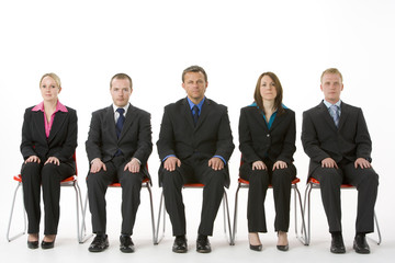 Group Of Business People Sitting In A Line
