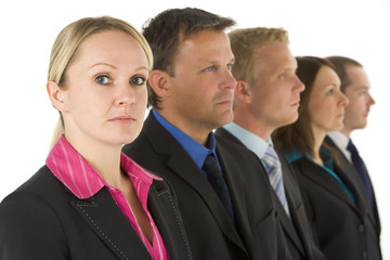 Group Of Business People In A Line Looking Serious