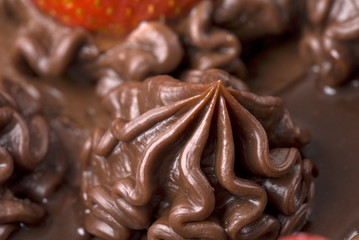 Chocolate Cake with strawberries on white .