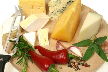 Cheese and herbs on a wooden board. Food photography.