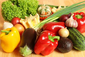 Colorful vegetables on a wooden table.