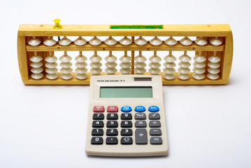 Traditional abacus and modern calculator