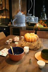 table with pumpkin in country kitchen