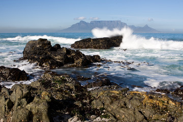Table Mountain from Bloubergstrand with rocks in the foreground