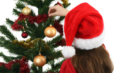 Christmas time - girl decorating Christmas tree