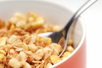 Bowl of muesli. White background, selective focus.