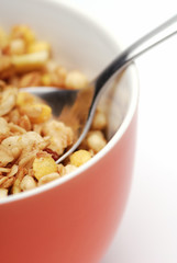 Bowl of muesli. White background, selective focus.