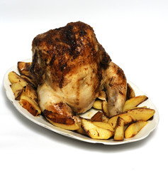 Hen to roasted dutch oven on broach on plate with garnish