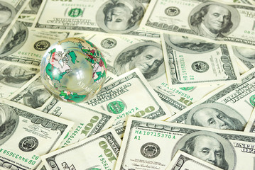 globe isolated on a dollars background
