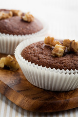 Chocolate muffins with crushed nuts