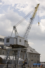 Fototapeta na wymiar Vertical image of a Derrick crane at a port.