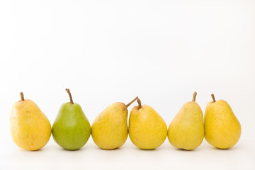 yellow and green pears in a row