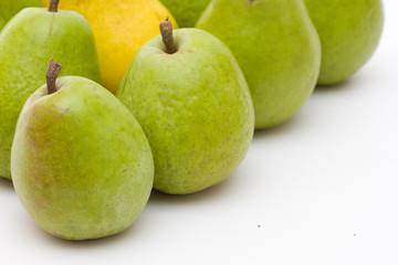 yellow and green pears on white with copy space