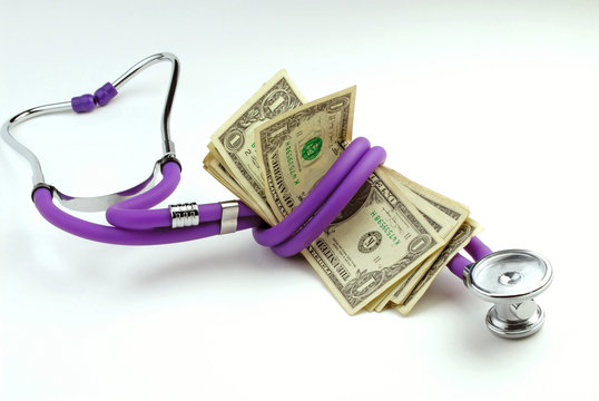 Medical stethoscope and pack of one-dollar banknotes