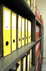 Coloured file folders in office cabinet
